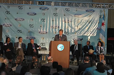 Above: In an event jointly branded by Ford, CPS, and the City of Chicago, Ford Motor Company Executive Chairman Bill Ford talks about how the “Henry Ford Learning Institute’ will launch a network of ‘model’ charter schools beginning with the Chicago Powerhouse Charter High School in the converted Sears powerhouse at 931 S. Homan Ave. in Chicago, where the event took place. Left to right: Sabrena Davis (principal of Powerhouse Charter School, which will open in 2008), Chicago Schools CEO Arne Duncan, Chicago Mayor Richard M. Daley, Bill Ford (speaking), John Nichols (Vice Chairman, The Marmon Group), Rufus Williams (President Chicago Board of Education), and Linda Wing (Deputy Director, University of Chicago Center for Urban School Improvement). Substance photo by George N. Schmidt. 